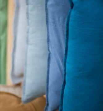 a row of pillows hanging on a wall