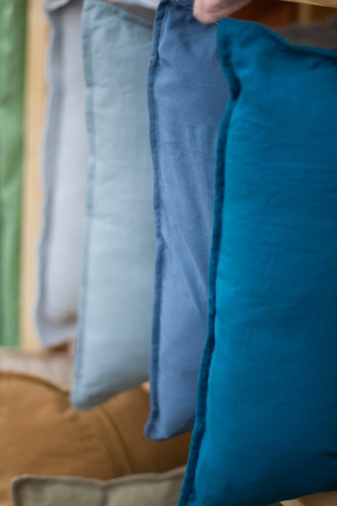 a row of pillows hanging on a wall